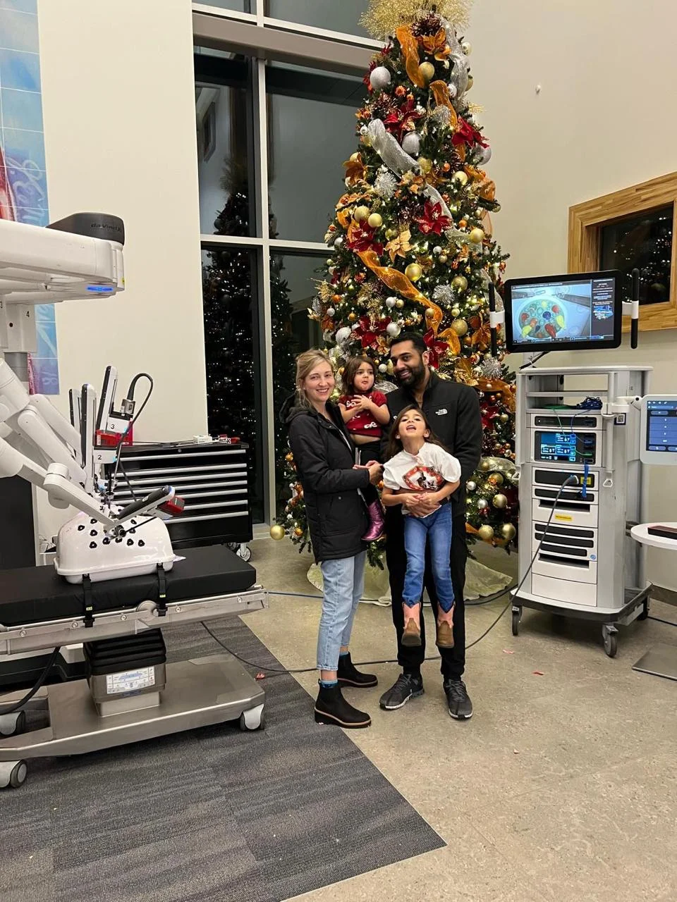 Dr. Dattani with his family in the operating room at Christmas